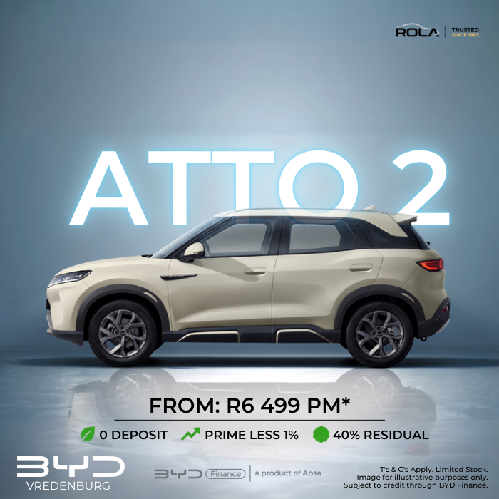 Side profile of a beige BYD Atto 2 SUV featuring a promotional vehicle finance offer of R6,499 per month with zero deposit, available at Rola BYD Vredenburg.